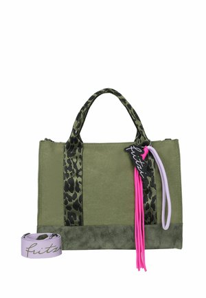 Green fabric handbag with leopard print handles, pink and purple decorative tassels, and a rolled purple shoulder strap with black script.