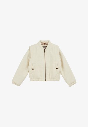 Quilted krem jakna s patentnim zatvaračem, bočnim džepovima i rebrastim manžetama. Unutra se nalazi obložni materijal s uzorkom. Standardni bomber stil.