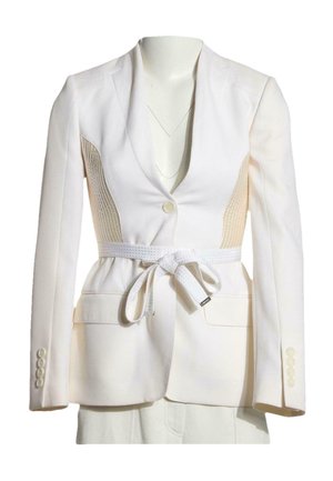 White tailored blazer with single button, textured side panels, matching belt tied in a bow, and four buttons on each sleeve cuff.