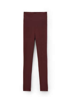 Burgunderfarbene gerippte Leggings mit einem breiten, glatten Bund, eng anliegenden Beinen und einem strukturierten Muster überall. Der Stoff wirkt dehnbar und weich.