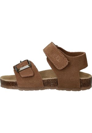 Bruine suède sandaal met open teen, verstelbare gesp aan de voorkant en brede klittenbandsluiting bij de enkel, kurken voetbed en textuurzool.