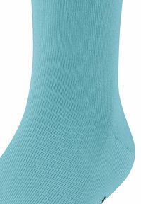 Turkusowa bawełniana skarpetka o prążkowanej fakturze, z wzmocnioną piętą i palcem, zaprojektowana z myślą o komforcie i trwałości. Brak widocznych wzorów.