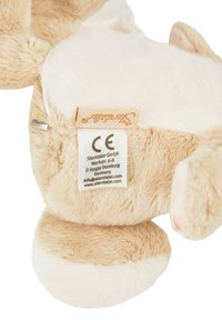 Plush rabbit toy in beige and white, made of soft fabric. Features a stitched label and textured paws. Round shape with floppy ears.