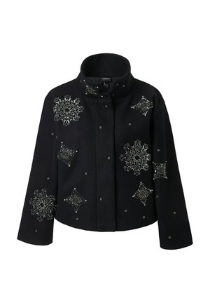Black cropped jacket with high collar, decorated with silver beaded star and snowflake patterns on front and sleeves.