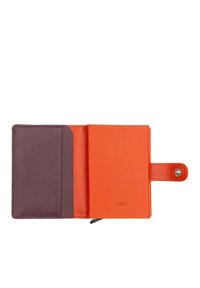 Orange leather wallet with a purple interior, featuring a snap closure and card slot. Smooth texture and minimal branding present.