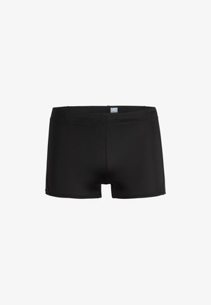 Shorts de bain noirs en matériau lisse et extensible. Présentent un design simple avec une taille mi-haute et sans motifs ni quincaillerie.