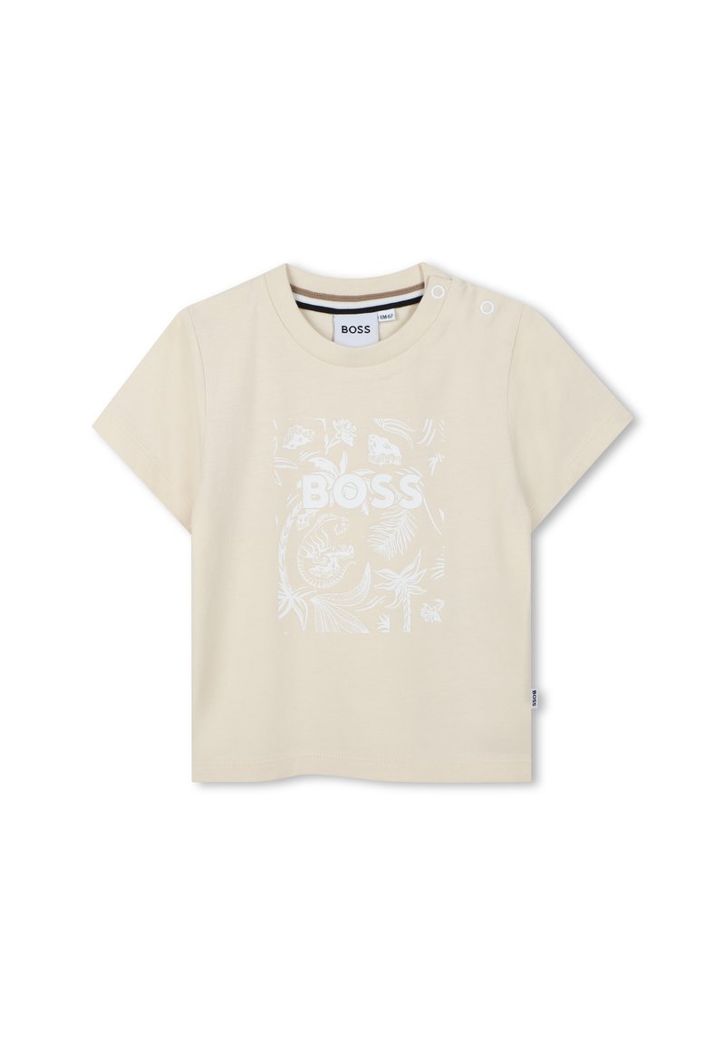 Beige t-shirt met korte mouwen van katoen, voorzien van een witte grafische afbeelding van bladeren en dieren, met drukknoopaccenten op de schouder.