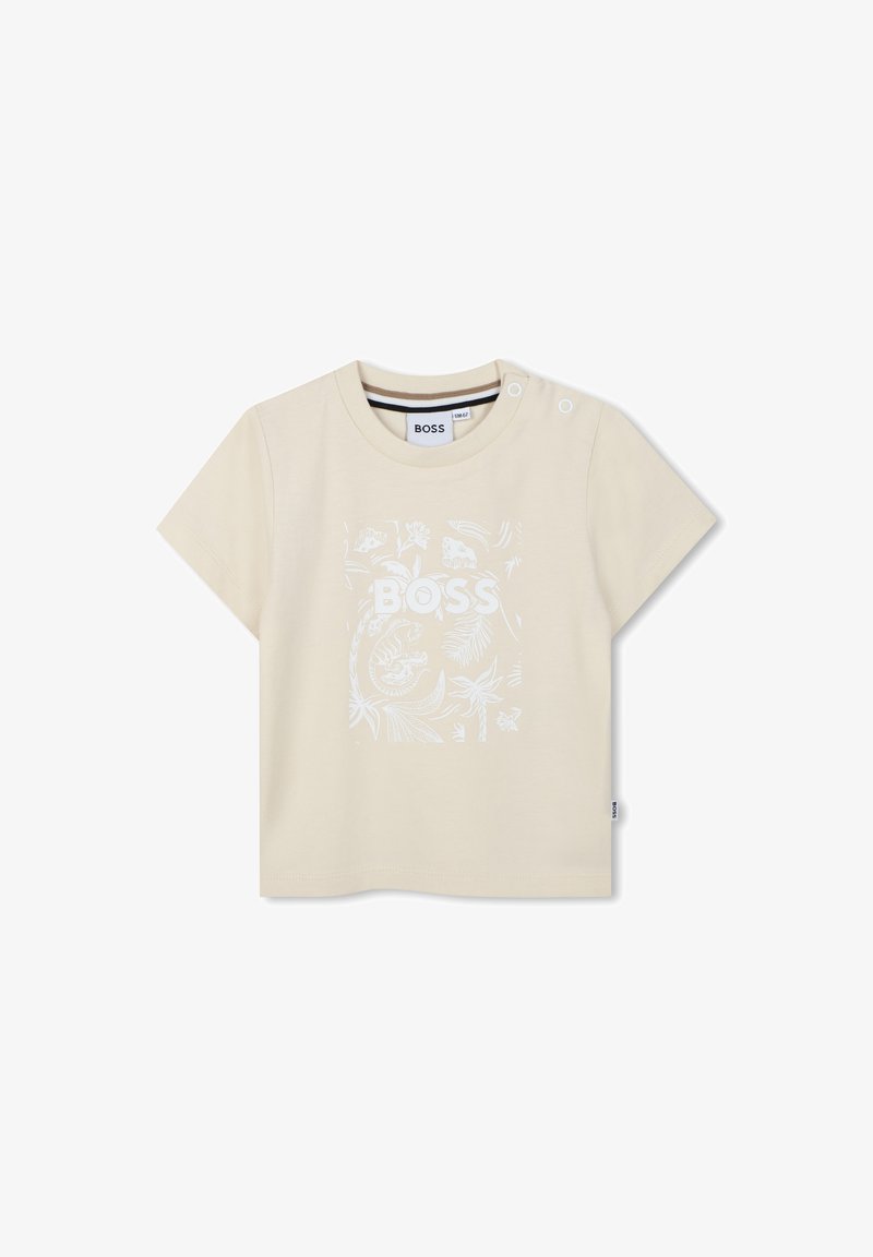 Beige t-shirt met korte mouwen van katoen, voorzien van een witte grafische afbeelding van bladeren en dieren, met drukknoopaccenten op de schouder.