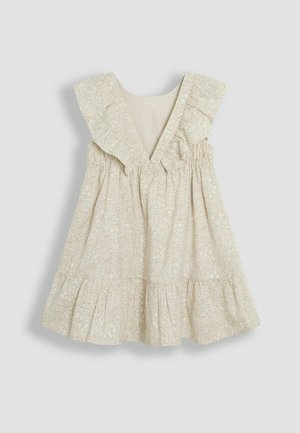 Világos bézs virágmintás ruha fodros vállakkal, V-nyakkivágással és réteges szoknyával. Puha, textúrált anyag.