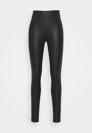 Leggings noirs avec un motif serpent texturé, fabriqués en matériau extensible, dotés d'une taille haute et d'une coupe fuselée jusqu'aux chevilles.