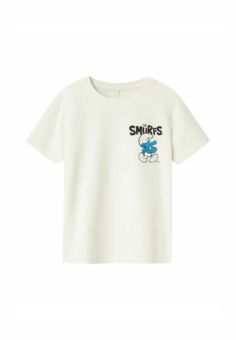Camiseta de algodón blanca con un gráfico impreso de un pitufo azul y el texto negro "LOS PITUFOS" en la parte frontal, mangas cortas y cuello redondo.