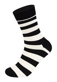 Chaussette rayée noir et blanc avec un bord côtelé. Présente de larges rayures horizontales et un orteil renforcé, fabriquée en tissu doux et extensible.