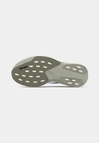 Shoe outsole featuring a grey rubber material with white traction patterns and a logo. Curved shape with slight elevation at the heel.