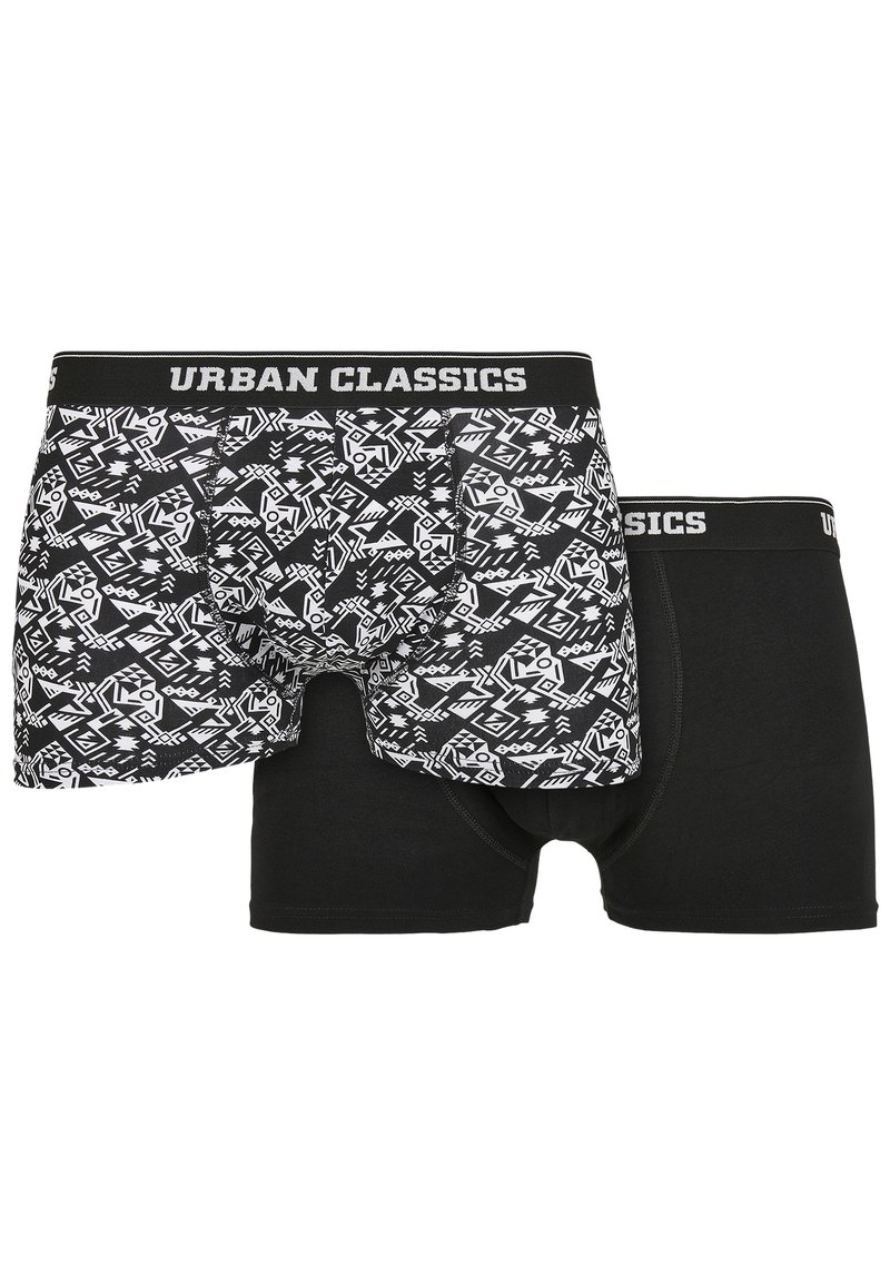 MustValge meeste boksershorts komplekt, mis sisaldab ühte paari geomeetriliste mustritega ja teist ühtlase mustana, mõlemad "URBAN CLASSICS" paelaga.