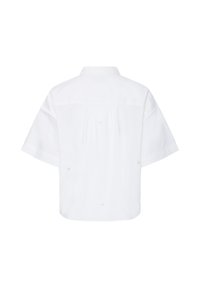 Chemise blanche à manches courtes avec col, coupe ample et détail plissé dans le dos, vue de dos.