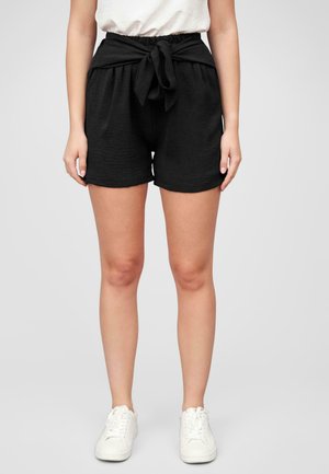 Black shorts made of textured fabric, featuring an elastic waistband with a tie detail at the front and a loose, relaxed fit.
