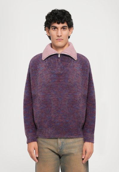 Knitted sweater in purple and blue hues with a textured finish, featuring a pink, zippered, oversized collar and long sleeves.