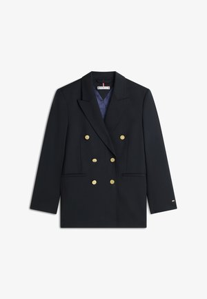 Donkerblauwe double-breasted blazer gemaakt van stof met een gladde textuur. Voorzien van gouden knopen, twee steekzakken aan de voorkant en een revers met inkeping.