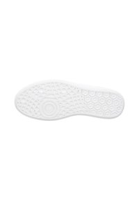 Weiße Gummisohle mit einer strukturierten Oberfläche, die hexagonale und kreisförmige Muster aufweist, um Grip und Flexibilität zu bieten.
