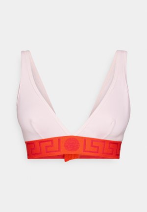 Bralette rosa chiaro con scollatura a V profonda, dotata di una fascia rossa audace con un motivo geometrico. Realizzato in un materiale liscio ed elasticizzato.