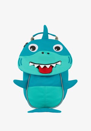 Türkisfarbene Haifisch-Rucksack mit großen Augen, einer roten Zunge und weißen Zähnen. Verfügt über einen Griff und seitliche Flossen; aus strapazierfähigem Stoff gefertigt.