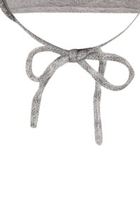 Gray-speckled fabric shoelace tied into a neat bow with visible knit texture on a white background.