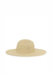 Chapeau de soleil en paille tissée beige à larges bords avec couronne arrondie, adapté à la protection solaire en extérieur.