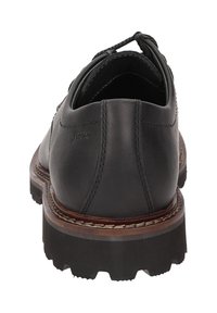 Scarpa nera in pelle con punta rotonda, cuciture dettagliate e suola in gomma robusta. Presenta una finitura liscia e una linguetta per facilitare l'indossamento.