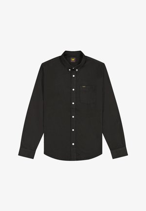 Must pikkade varrukatega särk valgete nuppudega, rinnatasku ja väikese kollase "Lee" logoga ning nööpidega kaelusega.