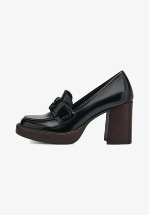 Black patent leather high-heeled loafer with a wide wooden block heel and a prominent buckle detail on the front. Smooth glossy finish.