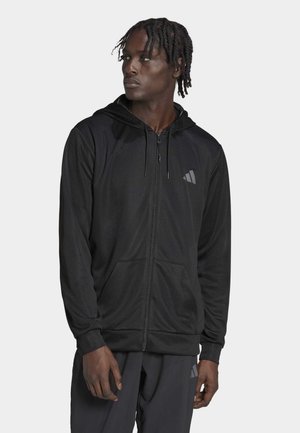 Schwarze Zip-Hoodie aus leichtem Stoff, ausgestattet mit einer Kordelzugkapuze, Fronttaschen und einem dezenten Logo auf der Brust.