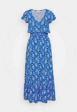 Vestido maxi azul con pequeño estampado floral blanco, escote en V, mangas cortas con vuelo, cintura elástica y falda de volantes.