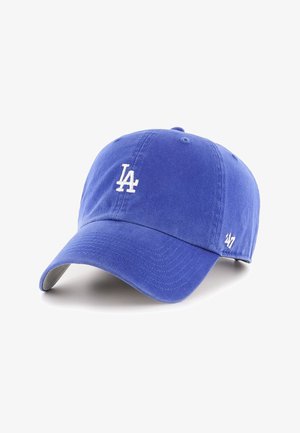 Gorra de béisbol azul con el logo blanco "LA" al frente y el logo "'47" en el lateral, presentada sobre un fondo blanco.