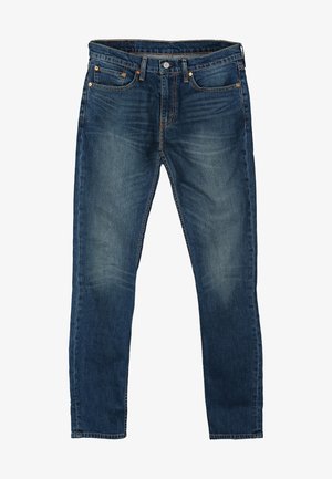 Blå slim-fit denim jeans med fem lommer og afblegede områder på lårene og knæene.