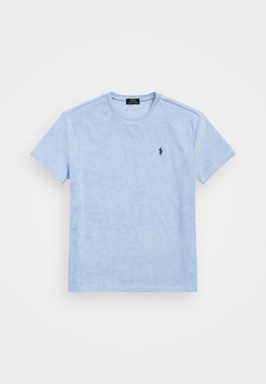 Lichtblauw terrycloth T-shirt met korte mouwen, ronde hals en een klein, donker geborduurd logo op de linkerborst.