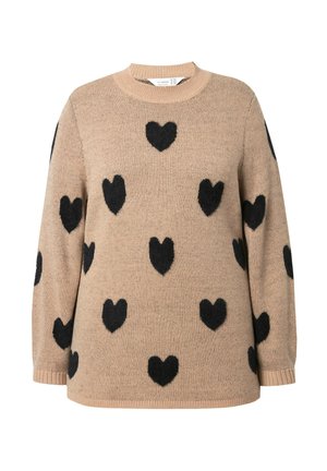 Beżowy sweter wykonany z miękkiego, dzianinowego materiału z czarnymi wzorami w kształcie serc. Posiada okrągły dekolt, długie rękawy oraz ściągacze na mankietach i u dołu.