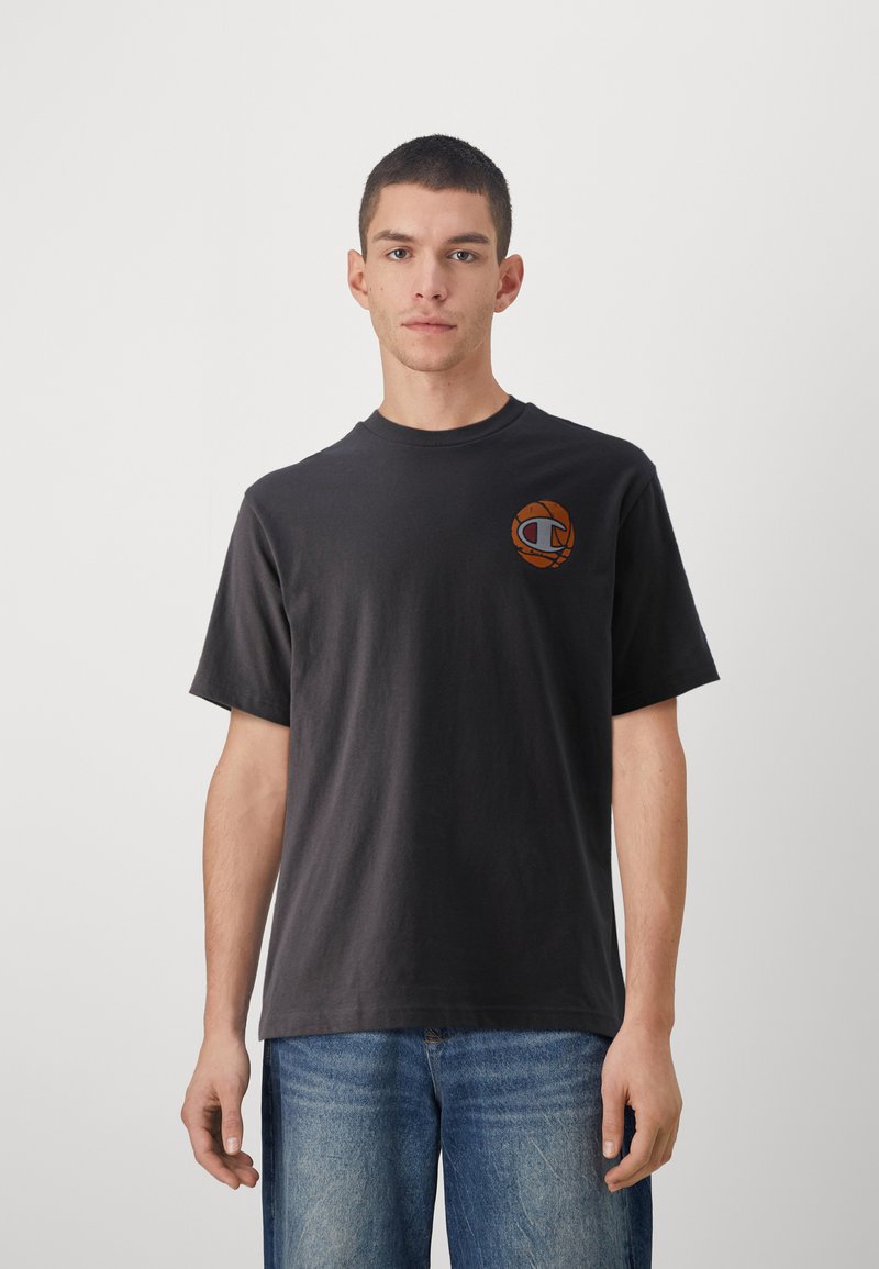 Dark gray cotton t-shirt with short sleeves. Features a colorful circular logo on the left chest. Simple design; crew neckline.