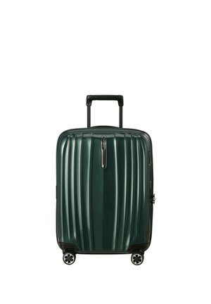 Dark green hard-shell suitcase with vertical ridges, four spinner wheels, and a retractable black handle.