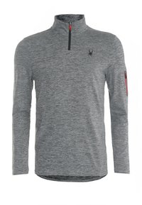 Harmaa pitkähihainen pusero, jossa korkea kaulus, etuvetoketju, sivutasku punaisella korostuksella ja musta logo rinnassa.