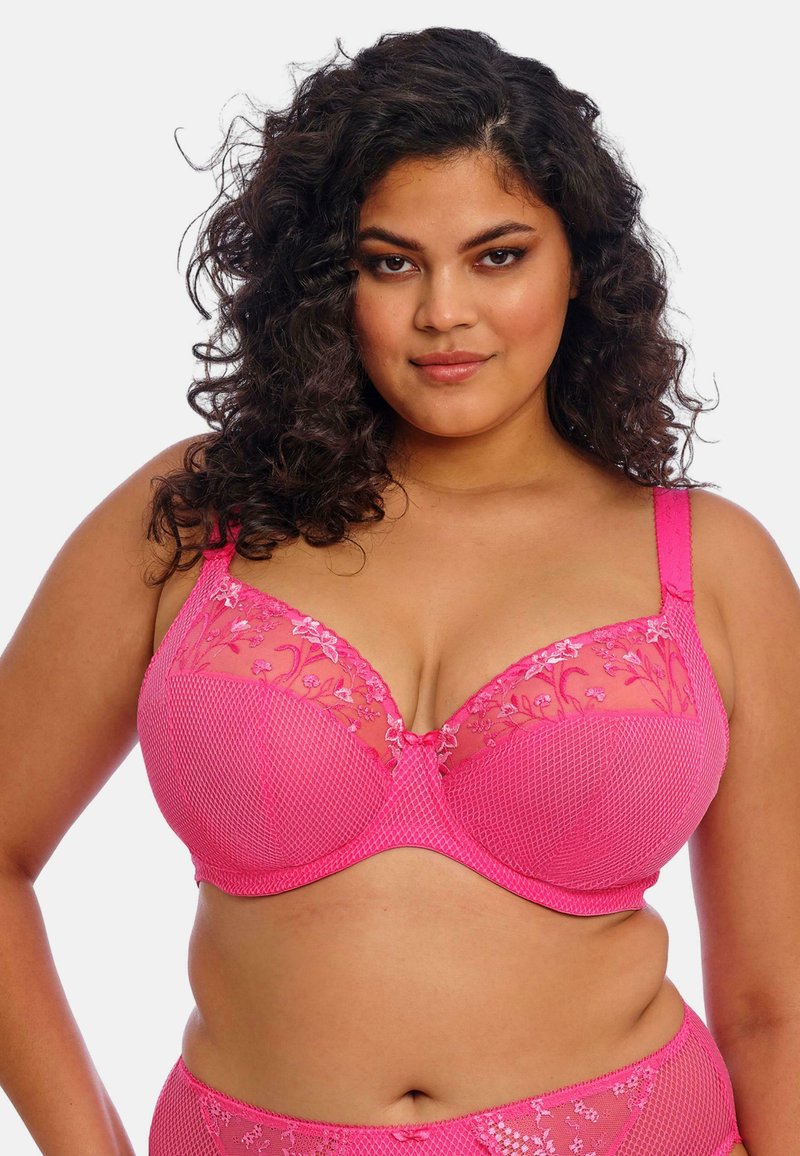 Růžové krajkové podprsenky s květinovou výšivkou, síťovanými panely a nastavovacími ramínky. Texturovaná tkanina s poloprůhledným povrchem.