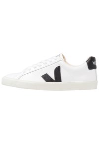 White sneaker with a black V logo, featuring a smooth leather upper, round toe, lace-up closure, and contrasting black heel tab.