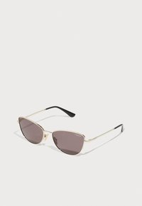 Saulesbrilles - pale gold-coloured