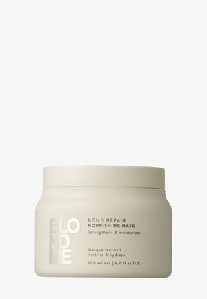 Pot en plastique blanc avec une finition mate, étiqueté "BLONDME BOND REPAIR NOURISHING MASK", avec du texte argenté et un couvercle à vis. Contenant : 200 ml.
