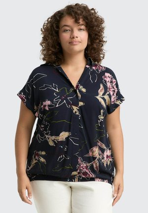 Navy floral blouse with short sleeves, featuring a button-down front, oversized fit, and vibrant pink and green floral patterns.