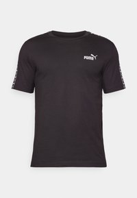 Crna kratka majica s kratkim rukavima od pamuka. Ima okrugli izrez, PUMA logo na prsima i uzorke duž rukava.