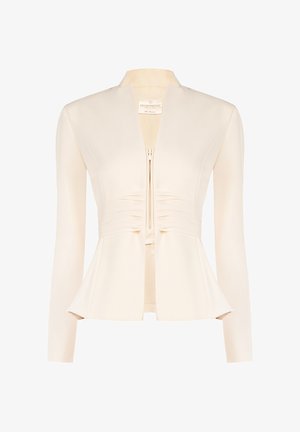 Veste ajustée de couleur crème avec manches longues, fermeture éclair à l'avant, détail froncé à la taille et ourlet légèrement évasé.