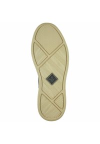 Rubber shoe sole with a herringbone pattern, beige color, and a central black diamond logo with "GANT" and "1949" text.