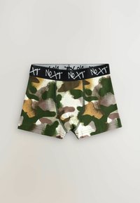 Camo-print boxers i grønne, brune, hvide og gyldne nuancer; sort elastik med "Next" logo i kontrasterende hvid. Blødt bomuldsstof.