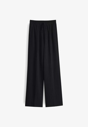 Schwarze weite Hosen mit Kordelzugbund, aus einem weichen Stoff, mit lockerer Passform und glatter Textur.