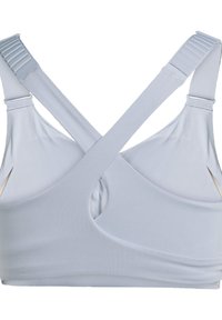 Light gray sports bra with a crossover back design, made from smooth, stretchy material; features adjustable straps and side openings.